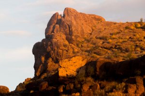 Dawn's light reaches the rock